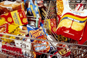 unhealthy snacks in a shopping cart