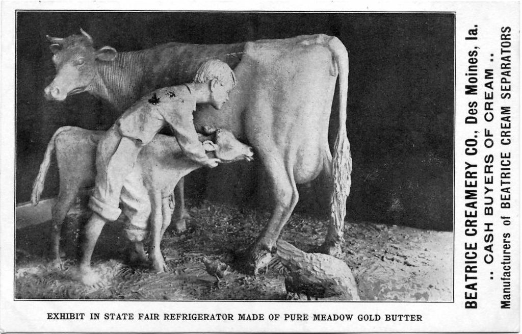 Butter sculpture of boy, cow, and calf